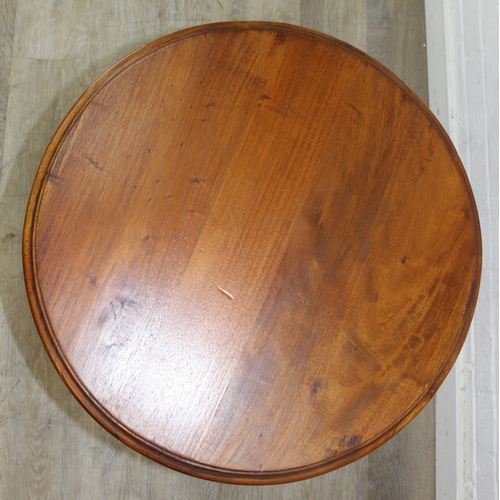 81 - An antique style round topped table with a trio of carved swans to base, 55cm in diameter x 66cm tal... 