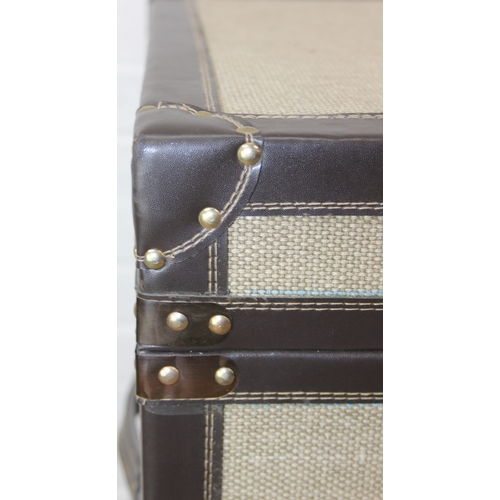 88 - An unusual fabric and faux leather aviator style chest of drawers, a lift up top over two banks of t... 