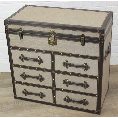 88 - An unusual fabric and faux leather aviator style chest of drawers, a lift up top over two banks of t... 