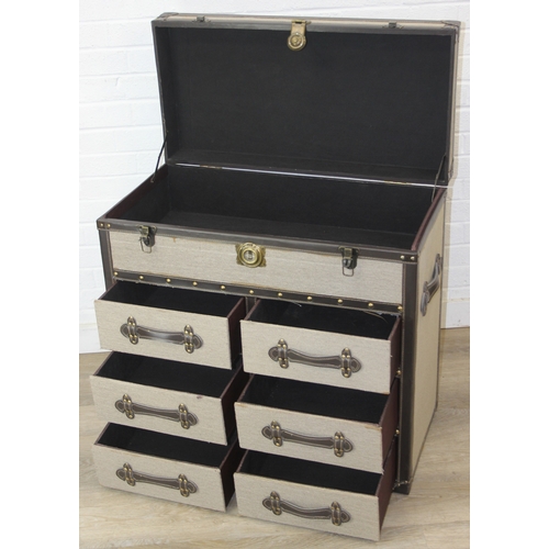 88 - An unusual fabric and faux leather aviator style chest of drawers, a lift up top over two banks of t... 