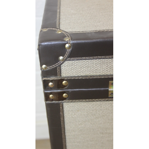 89 - An unusual fabric and faux leather aviator style chest of drawers, a lift up top over two banks of t... 