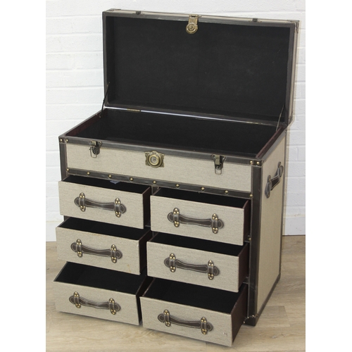 89 - An unusual fabric and faux leather aviator style chest of drawers, a lift up top over two banks of t... 