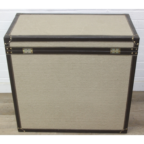 89 - An unusual fabric and faux leather aviator style chest of drawers, a lift up top over two banks of t... 