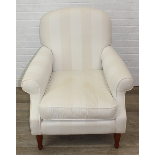 69 - An antique style white and cream striped Victorian style armchair with turned wooden legs, 83cm wide... 