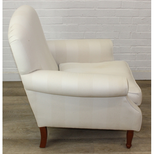 69 - An antique style white and cream striped Victorian style armchair with turned wooden legs, 83cm wide... 