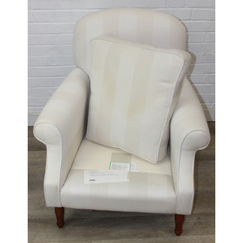 69 - An antique style white and cream striped Victorian style armchair with turned wooden legs, 83cm wide... 