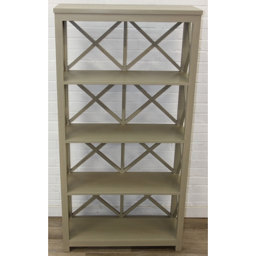 117 - A modern good quality green painted bookcase or display shelves with X fretwork style sides, believe... 