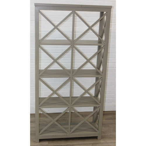 117 - A modern good quality green painted bookcase or display shelves with X fretwork style sides, believe... 