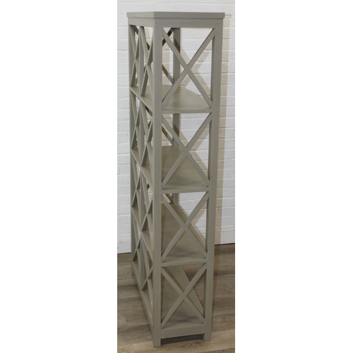 117 - A modern good quality green painted bookcase or display shelves with X fretwork style sides, believe... 
