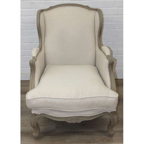 96 - An French style Fauteuil or armchair with distressed mocha coloured painted exposed wooden frame, th... 