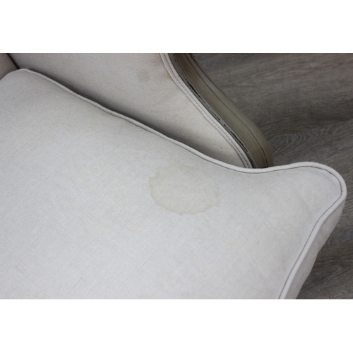 96 - An French style Fauteuil or armchair with distressed mocha coloured painted exposed wooden frame, th... 