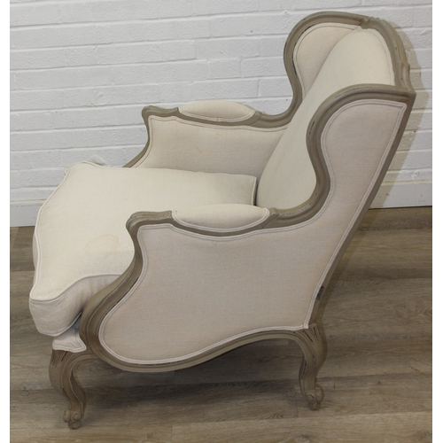 96 - An French style Fauteuil or armchair with distressed mocha coloured painted exposed wooden frame, th... 