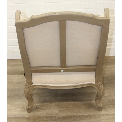 96 - An French style Fauteuil or armchair with distressed mocha coloured painted exposed wooden frame, th... 