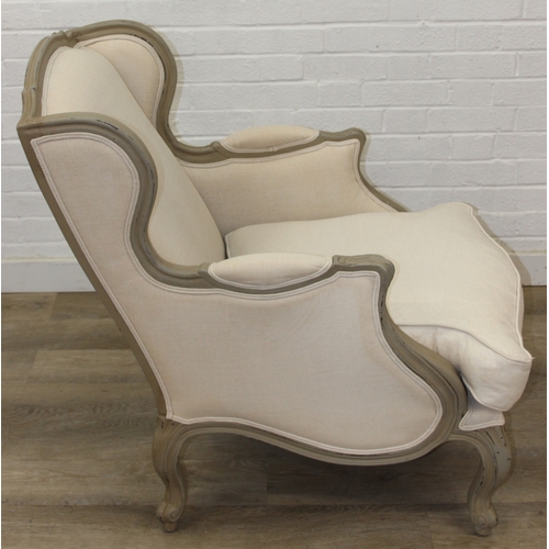 96 - An French style Fauteuil or armchair with distressed mocha coloured painted exposed wooden frame, th... 