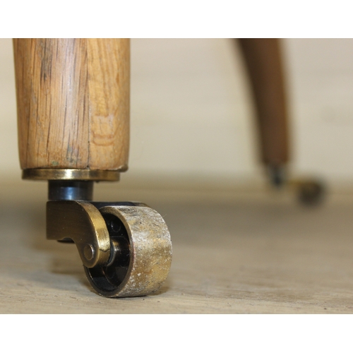 66 - Modern chaise lounge in cream upholstery, raised on blonde wood legs with brass castors, 150cm x 80c... 