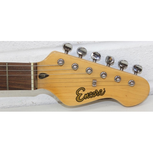735 - An Encore electric guitar with black body, 98cm long