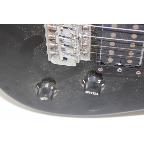 735 - An Encore electric guitar with black body, 98cm long