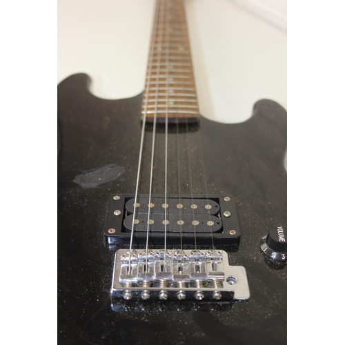 735 - An Encore electric guitar with black body, 98cm long