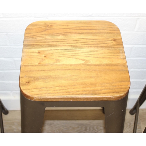 86 - A set of three industrial style metal frame stools with wooden tops, each 65cm tall [3]