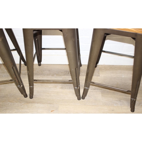 86 - A set of three industrial style metal frame stools with wooden tops, each 65cm tall [3]