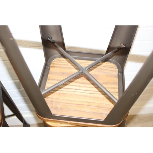 86 - A set of three industrial style metal frame stools with wooden tops, each 65cm tall [3]