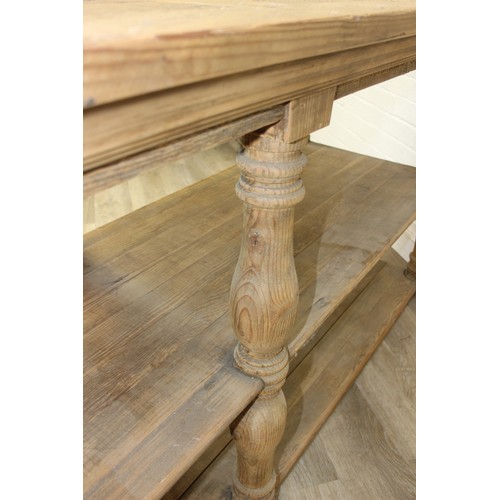 91 - A large rustic reclaimed oak and pine console table or island table with under-tier and turned legs,... 