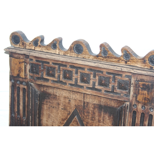 22 - An antique oak Wainscot chair with decorative top rail and carved geometric details to back, in part... 