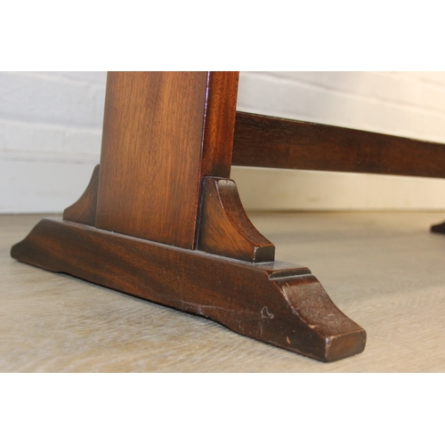 26 - A campaign style mahogany and brass drop leaf low table with brass corners and unusual central compa... 