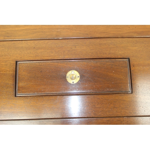 26 - A campaign style mahogany and brass drop leaf low table with brass corners and unusual central compa... 