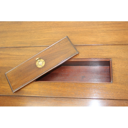 26 - A campaign style mahogany and brass drop leaf low table with brass corners and unusual central compa... 