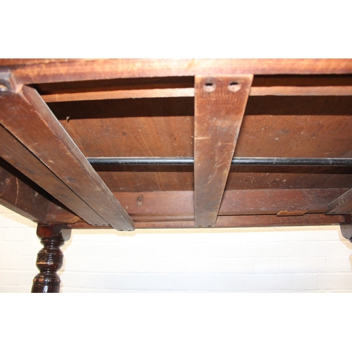 28 - Antique mahogany dining table with turned legs, 134cm x 104cm x 72cm