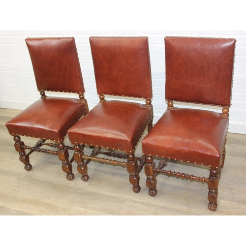 56 - A trio of Carolean style high backed chairs with brown leather seats and backs and studded details, ... 