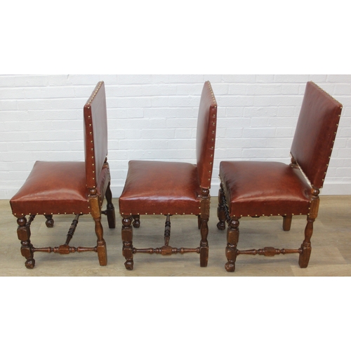 56 - A trio of Carolean style high backed chairs with brown leather seats and backs and studded details, ... 