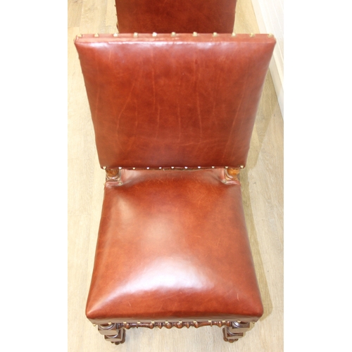 56 - A trio of Carolean style high backed chairs with brown leather seats and backs and studded details, ... 