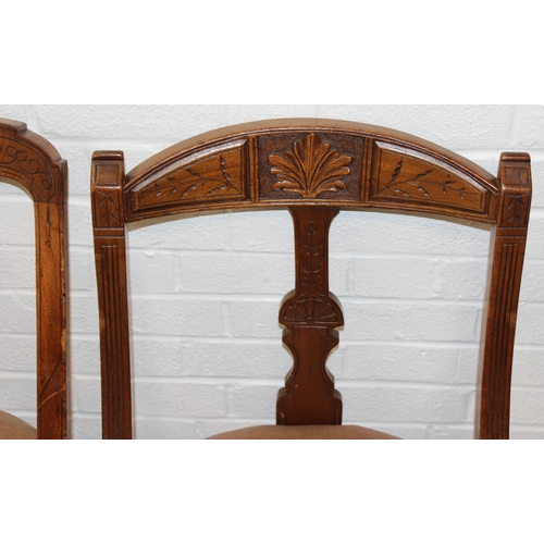 58 - A set of Four matched salon chairs with carved and curved backs and gold coloured upholstery, each 8... 