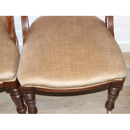58 - A set of Four matched salon chairs with carved and curved backs and gold coloured upholstery, each 8... 