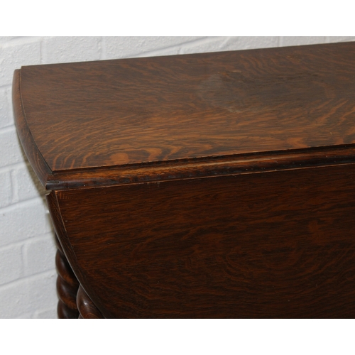 67 - An early 20th century oak dropleaf table with barleytwist supports, 77cm x 41cm (112cm) x 74cm