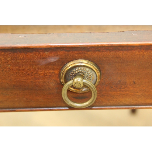 79 - A Regency period mahogany console table with long single drawer, raised back rail, all standing on t... 