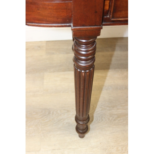 79 - A Regency period mahogany console table with long single drawer, raised back rail, all standing on t... 