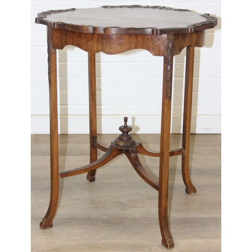 118 - A vintage mahogany side table with decorative carved edge, standing on four thin splayed legs, 61cm ... 