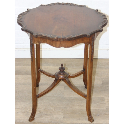 118 - A vintage mahogany side table with decorative carved edge, standing on four thin splayed legs, 61cm ... 