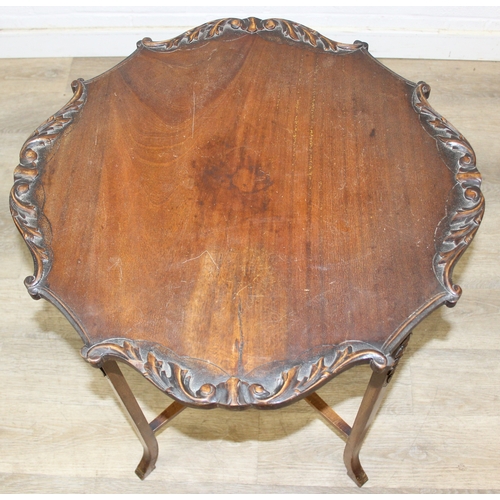 118 - A vintage mahogany side table with decorative carved edge, standing on four thin splayed legs, 61cm ... 