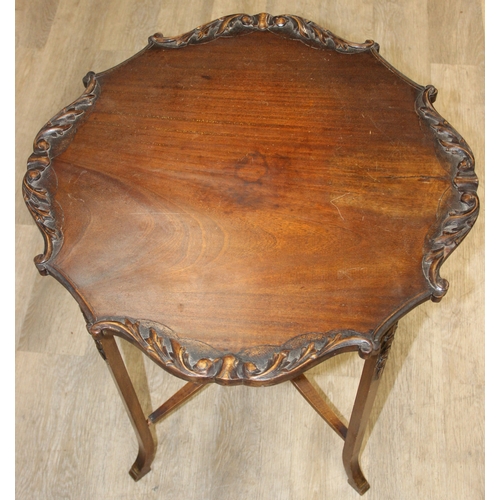 118 - A vintage mahogany side table with decorative carved edge, standing on four thin splayed legs, 61cm ... 