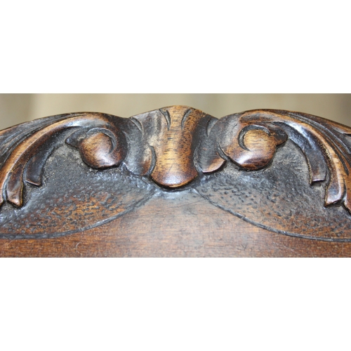 118 - A vintage mahogany side table with decorative carved edge, standing on four thin splayed legs, 61cm ... 