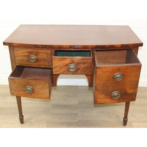 119 - A Regency period mahogany bow fronted sideboard with five drawers and brass handles, 121cm x 68cm x ... 