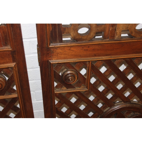 134 - A pair of Chinese style hardwood doors or panels, lattice geometric design, believed to be late 19th... 