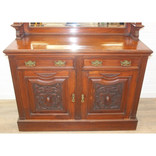 147 - Art Nouveau period mahogany sideboard with overmantel mirror, two drawers over heavily carved cupboa... 