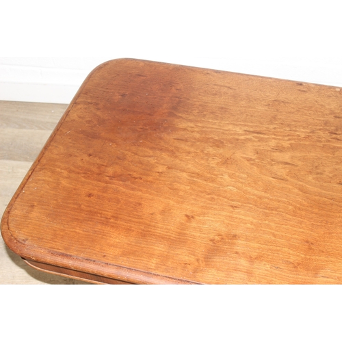 155 - A 19th century mahogany low table with decorative pedestal base, 127cm x 66cm x 49cm
