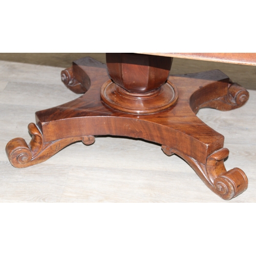 155 - A 19th century mahogany low table with decorative pedestal base, 127cm x 66cm x 49cm