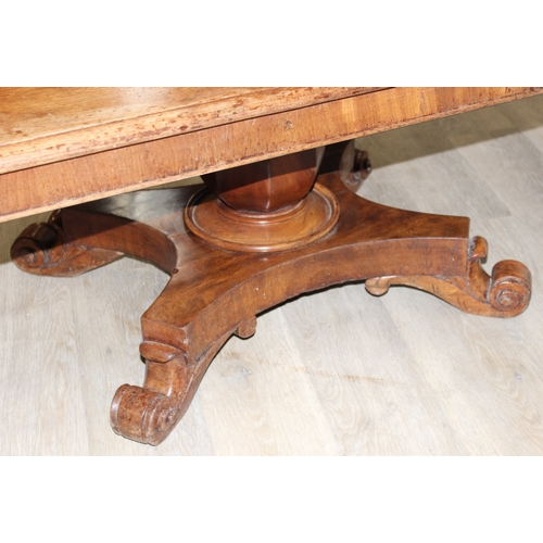 155 - A 19th century mahogany low table with decorative pedestal base, 127cm x 66cm x 49cm